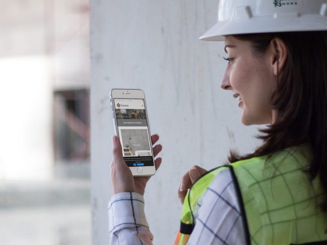 iphone-mockup-in-portrait-position-of-a-woman-architect-at-the-site-a12579 Tile web design