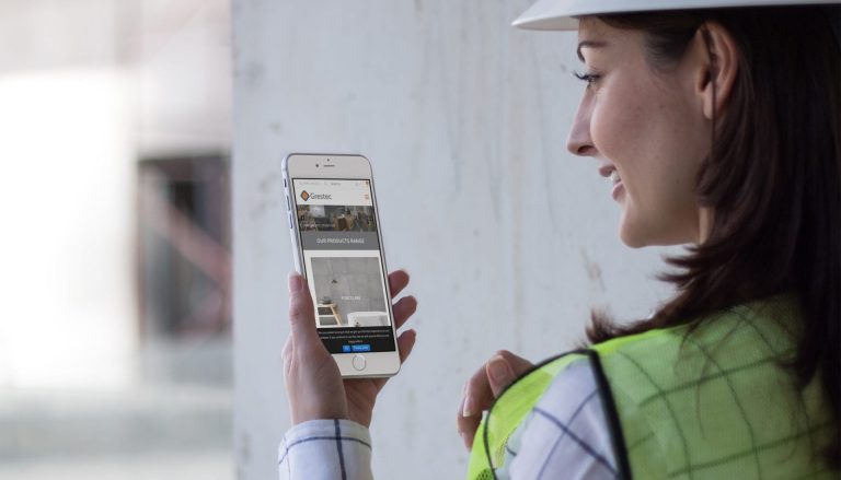 iphone-mockup-in-portrait-position-of-a-woman-architect-at-the-site-a12579 Tile web design